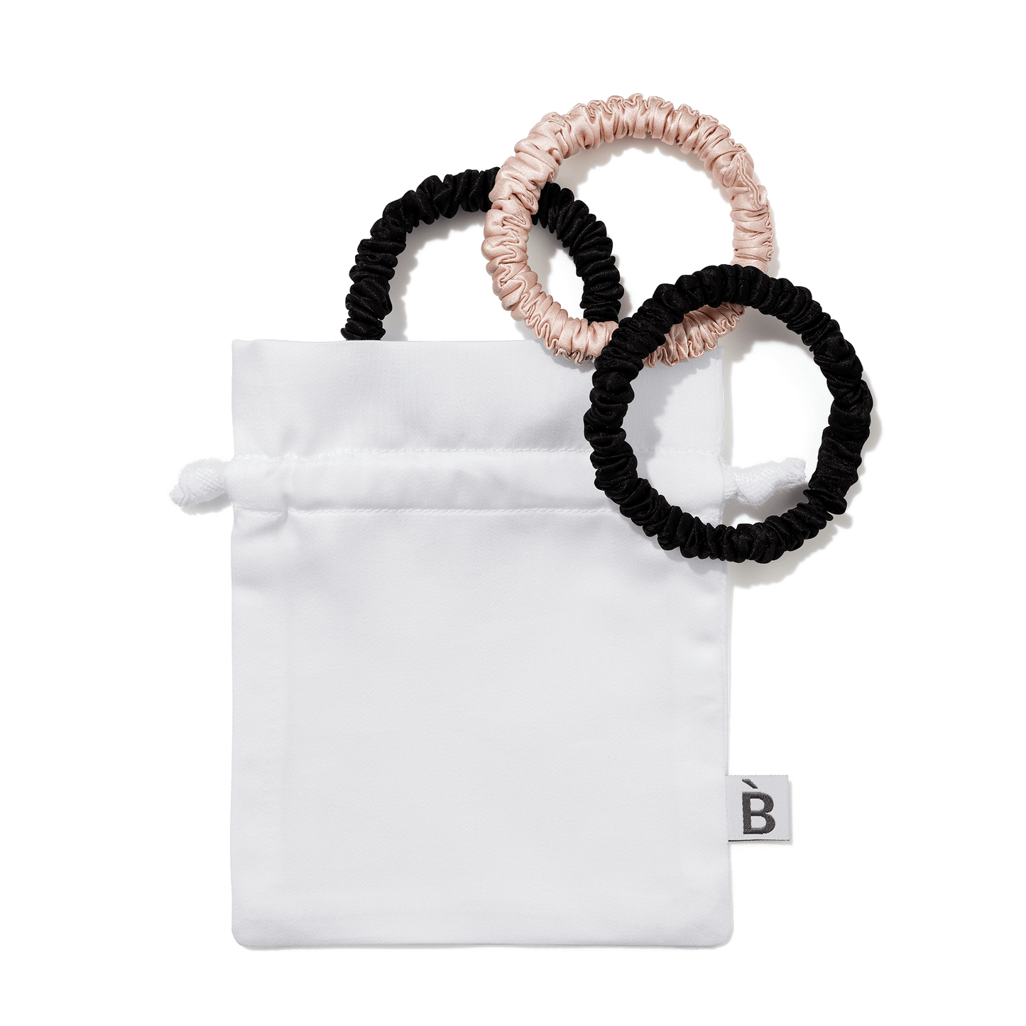 Skinny pack silk scrunchies in a white pouch