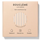 Bouclème satin-lined shower cap packaging on a beige background