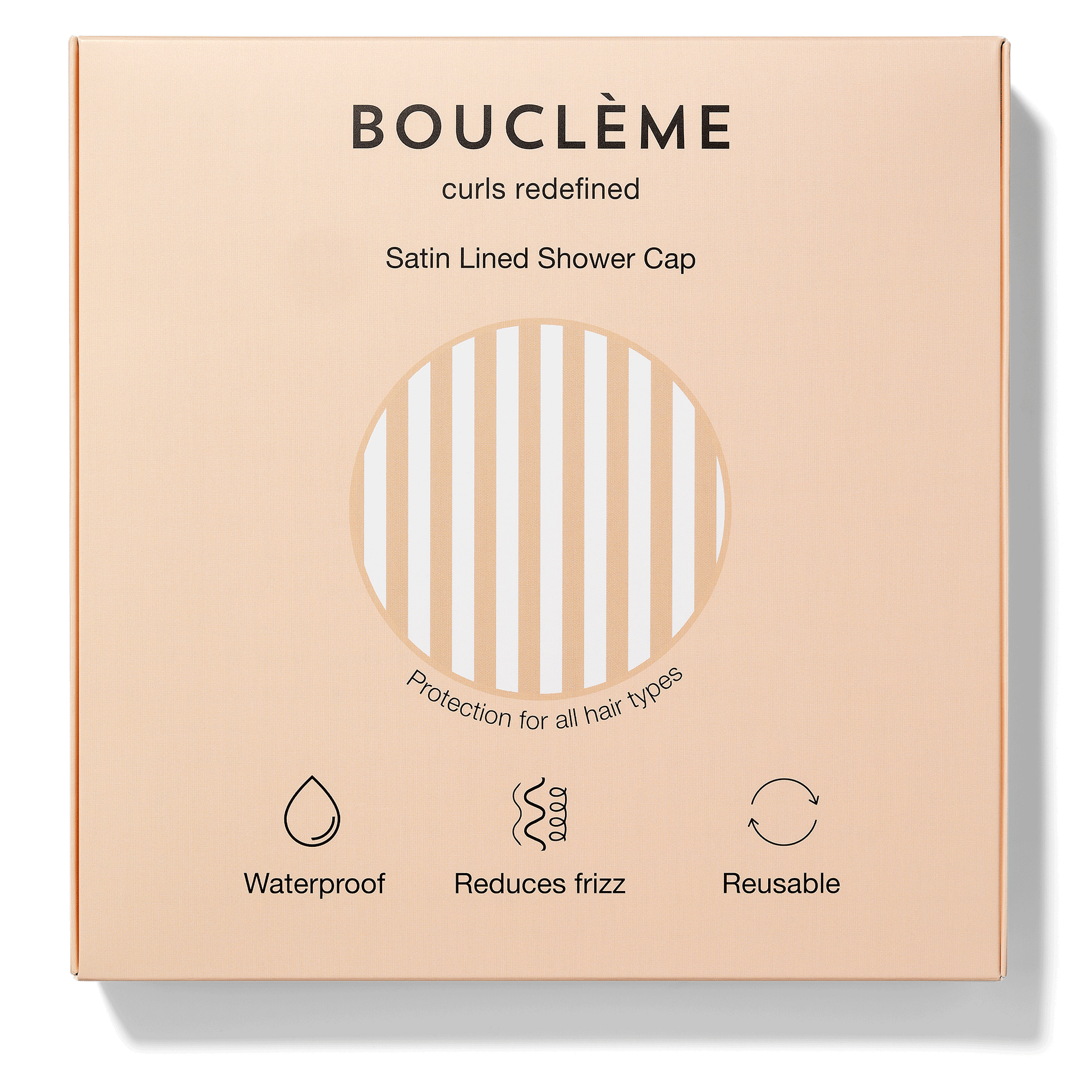 Bouclème satin-lined shower cap packaging on a beige background