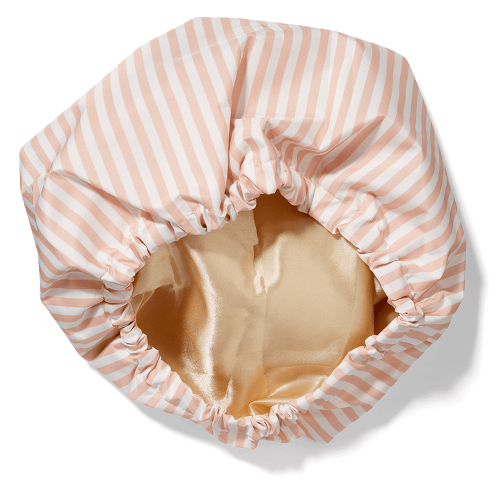 Bouclème satin-lined shower cap showing inner satin lining that protect curls