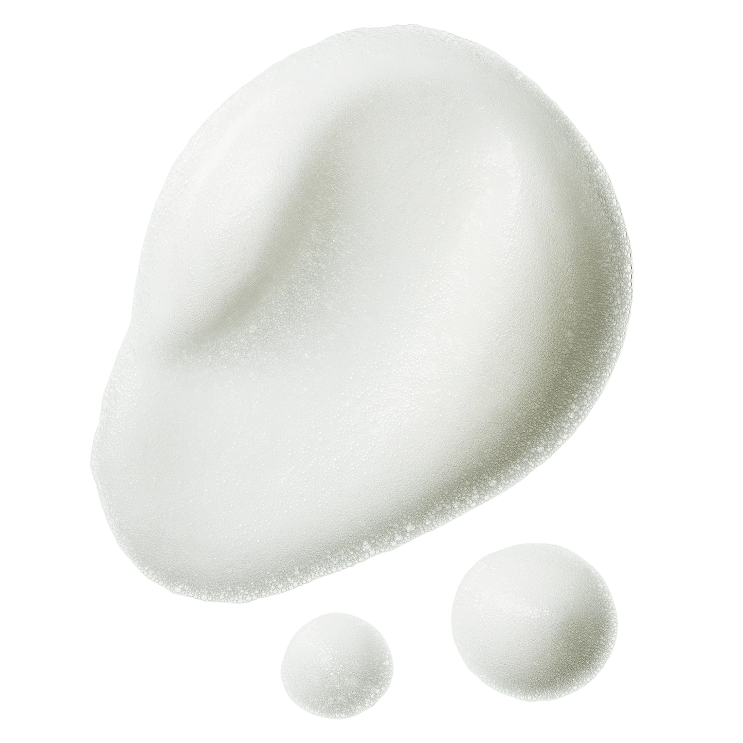 Close-up texture of the Super Volumising Foam showing its light, airy, foam-like consistency against a cream background