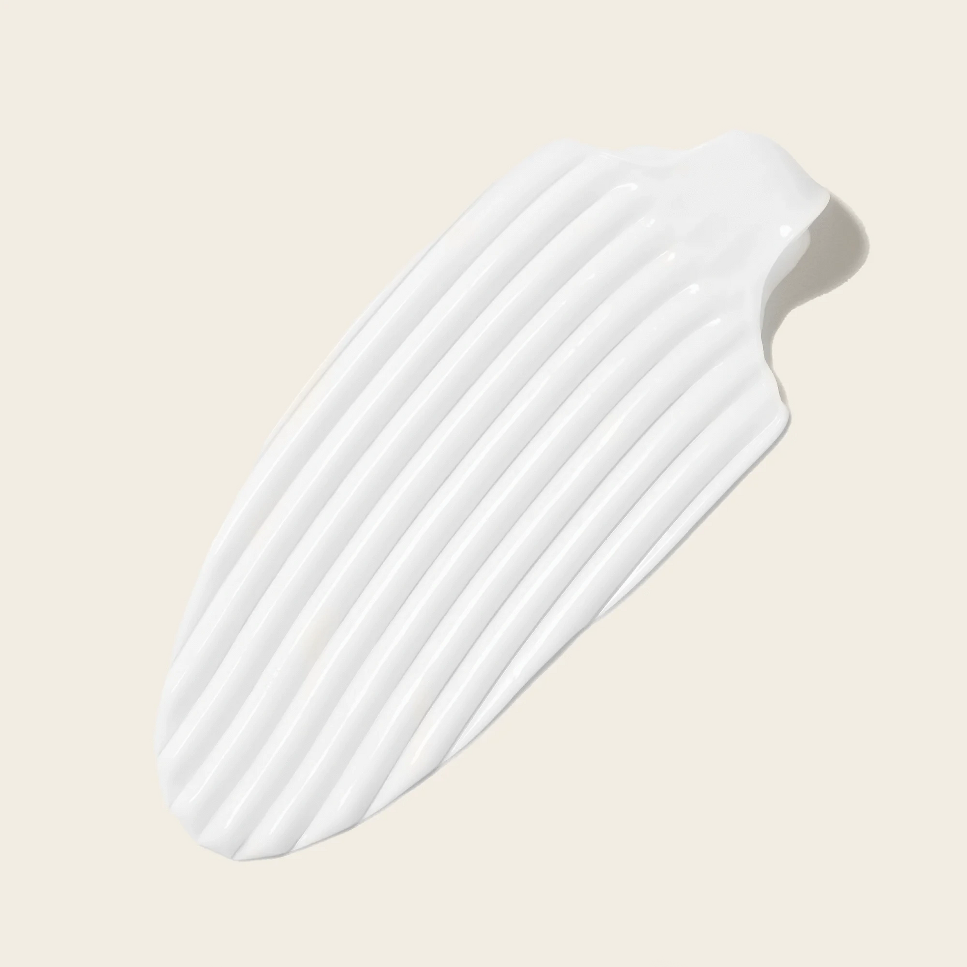 Close-up texture of Bouclème Curl Cream – rich, creamy and smooth for deeply nourishing curls.