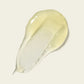 Close-up texture of the Super Hold Styler showing its dense, gel-like consistency designed to provide strong, flexible hold for curls, set against a cream background.