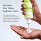 Curl Cleanser poured into a hand to show its creamy texture. Text: No foam. Just clean, hydrated curls.